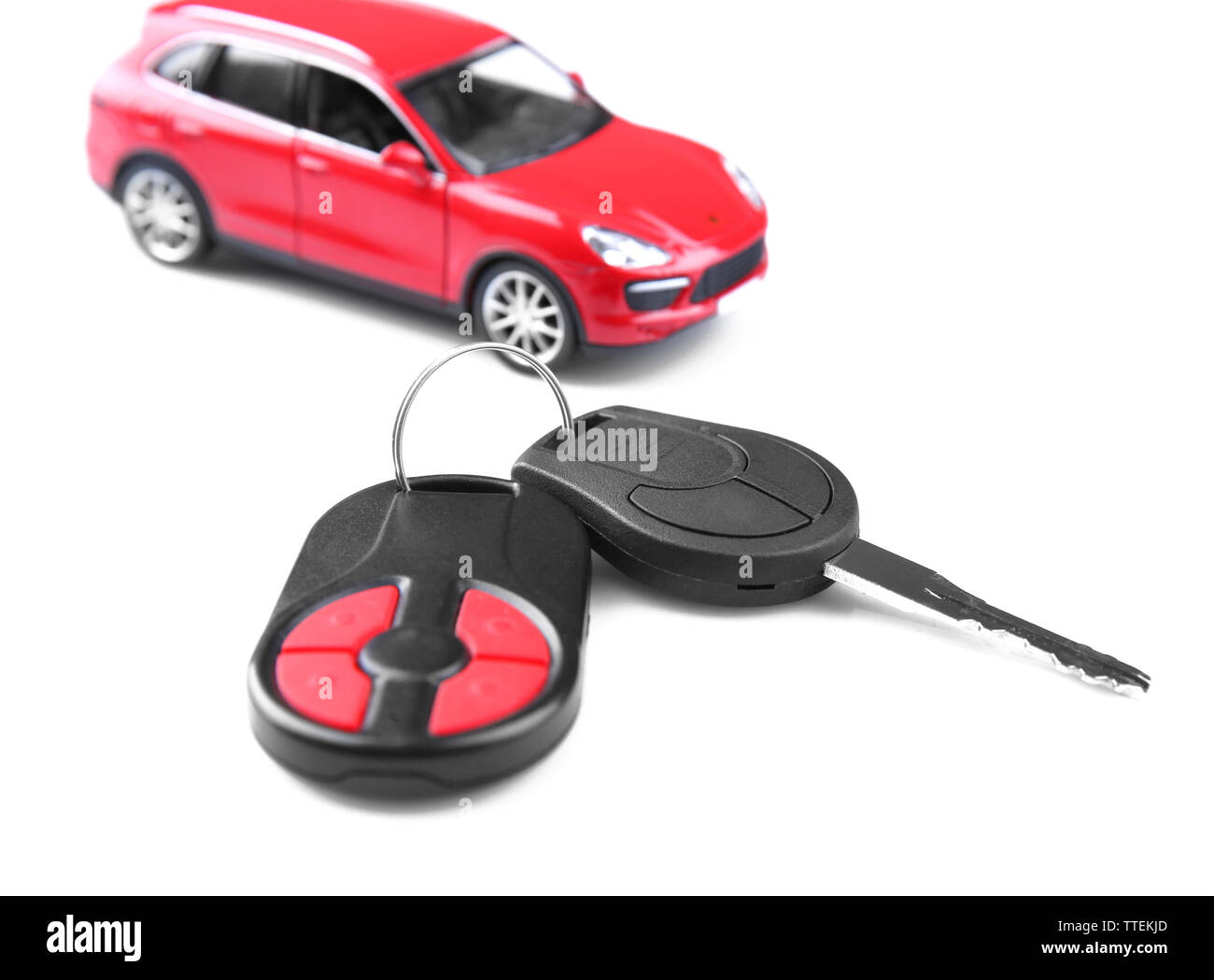 Little red car with key isolated on white background Stock Photo Alamy