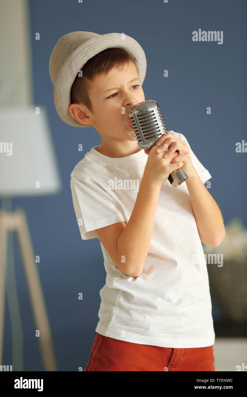 Little boy singing with microphone at home Stock Photo Alamy