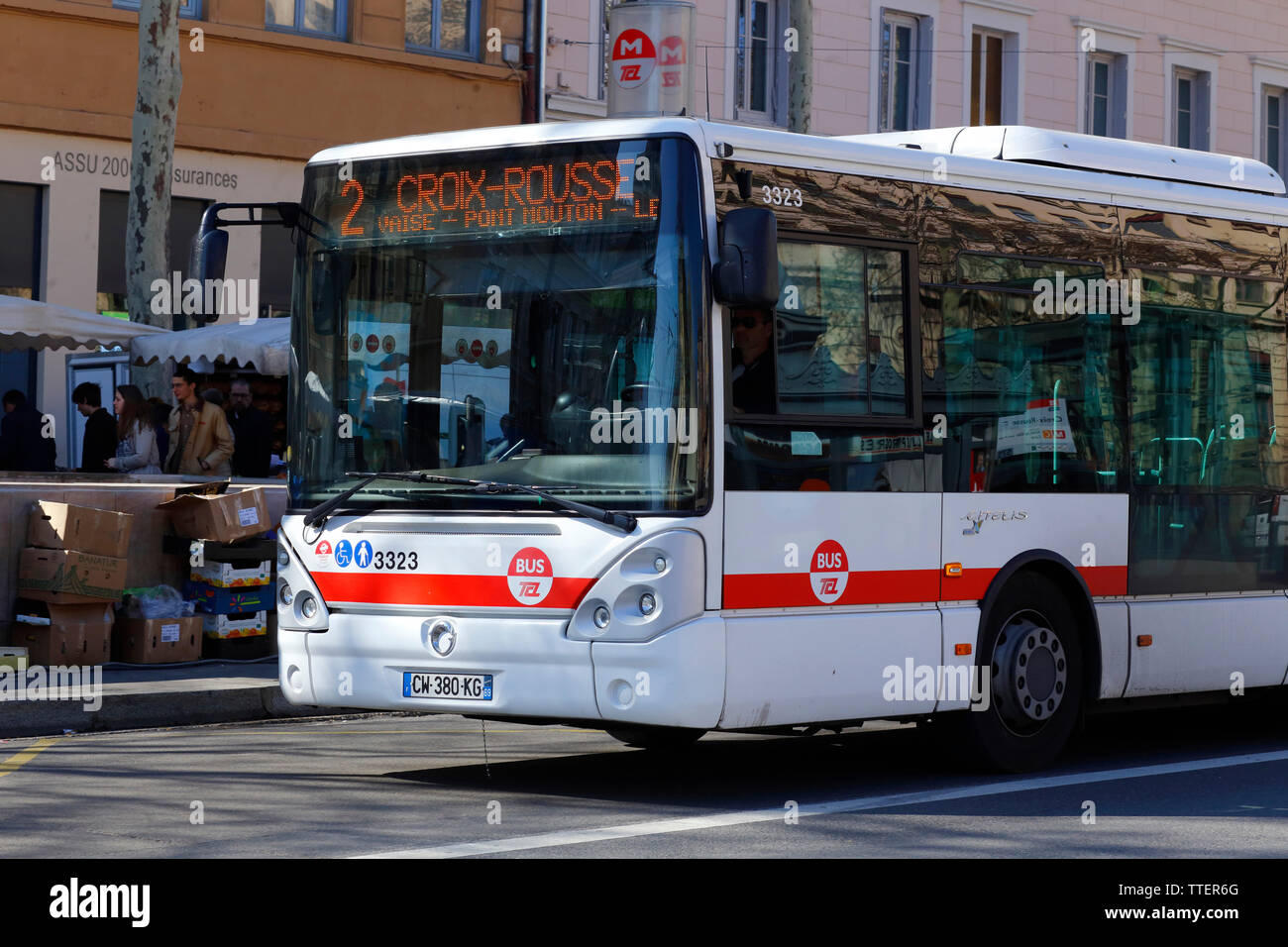 TCL Bus Line 2 on the Boulevard de la Croix-Rousse with the weekend Farmers Market in the background, Lyon, France Stock Photo