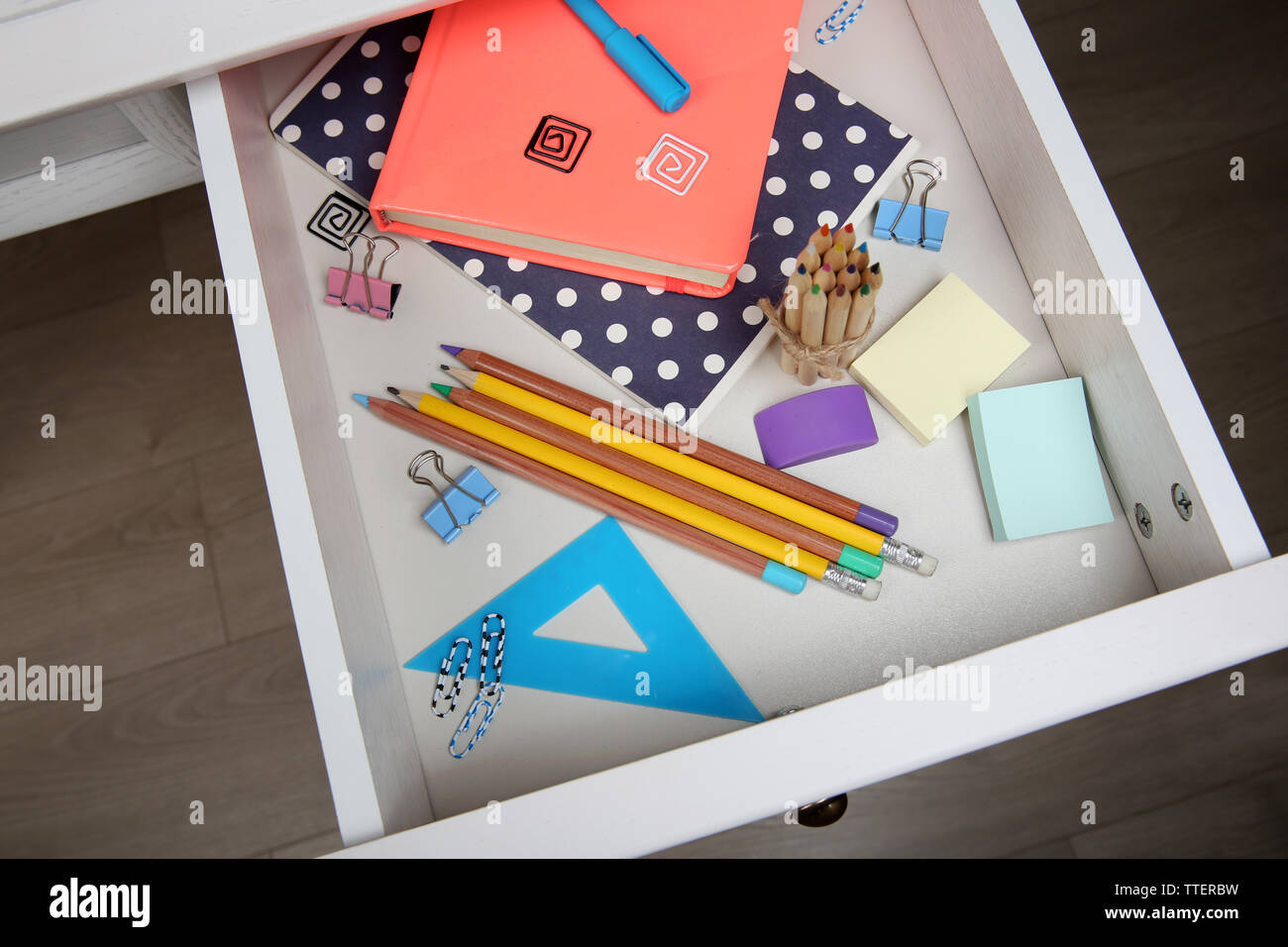 Stationery in open desk drawer closeup Stock Photo Alamy