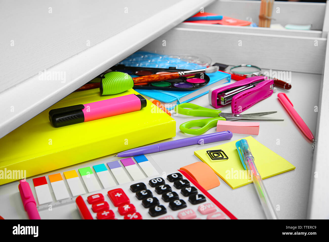 Stationery in open desk drawer closeup Stock Photo Alamy