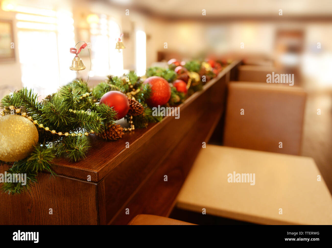 Christmas Decorations On Wooden Desk In Cafe Stock Photo