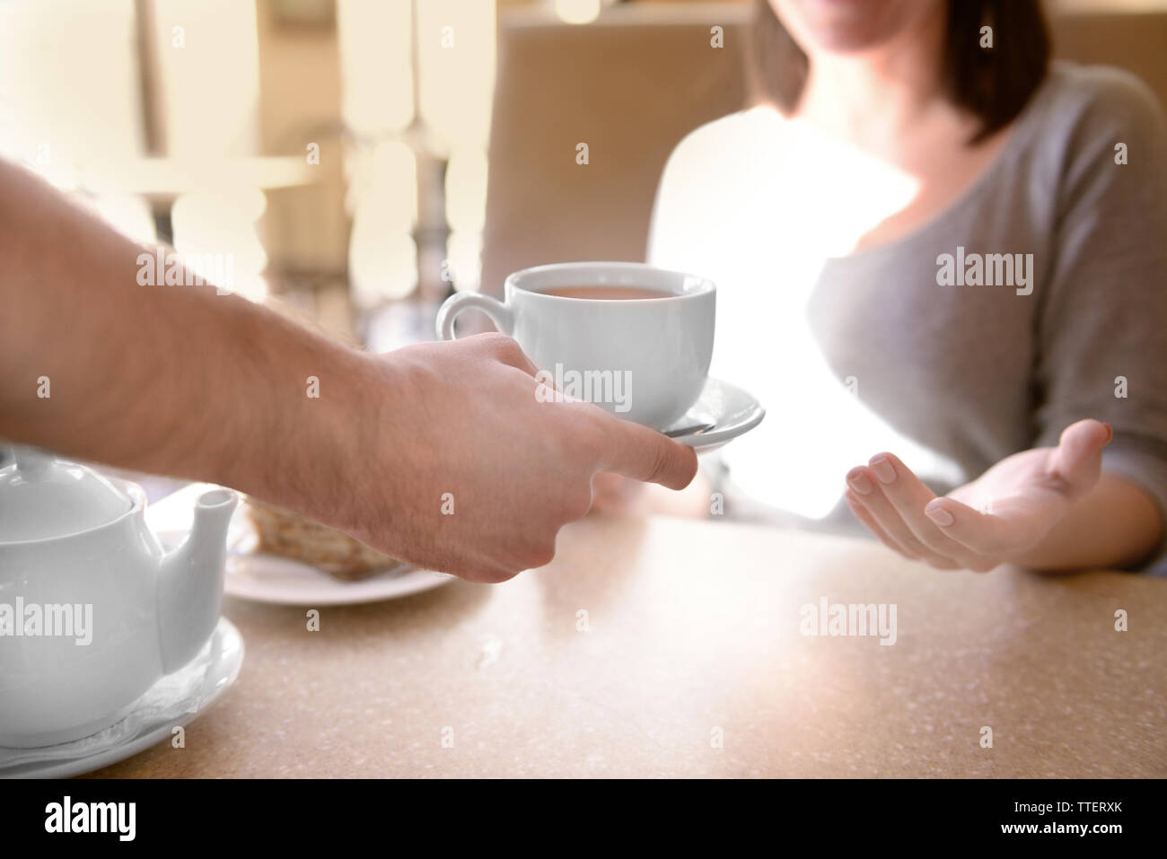 Serving tea to customer hi-res stock photography and images - Alamy