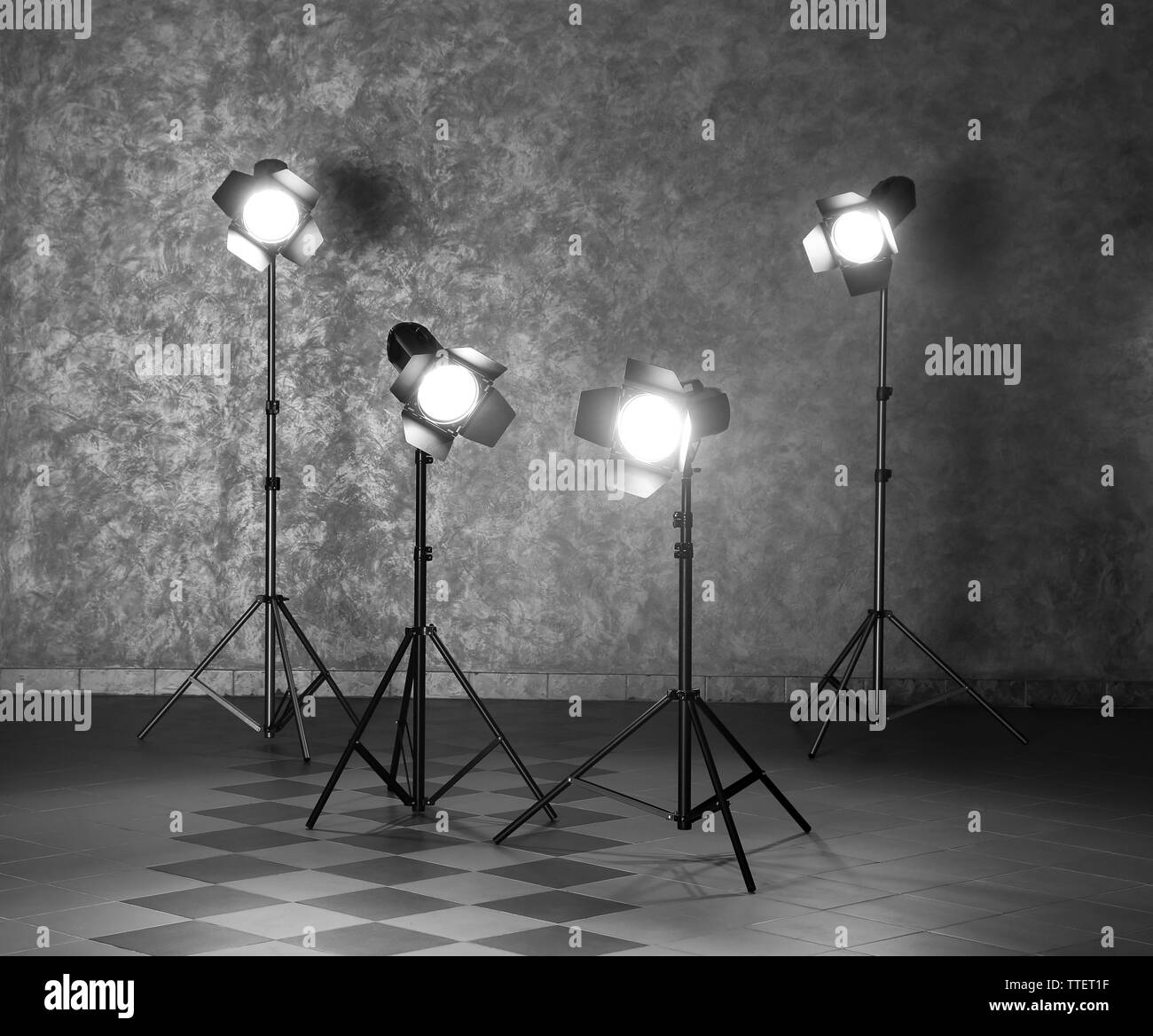 Lighting equipment on grey wall Stock Photo Alamy