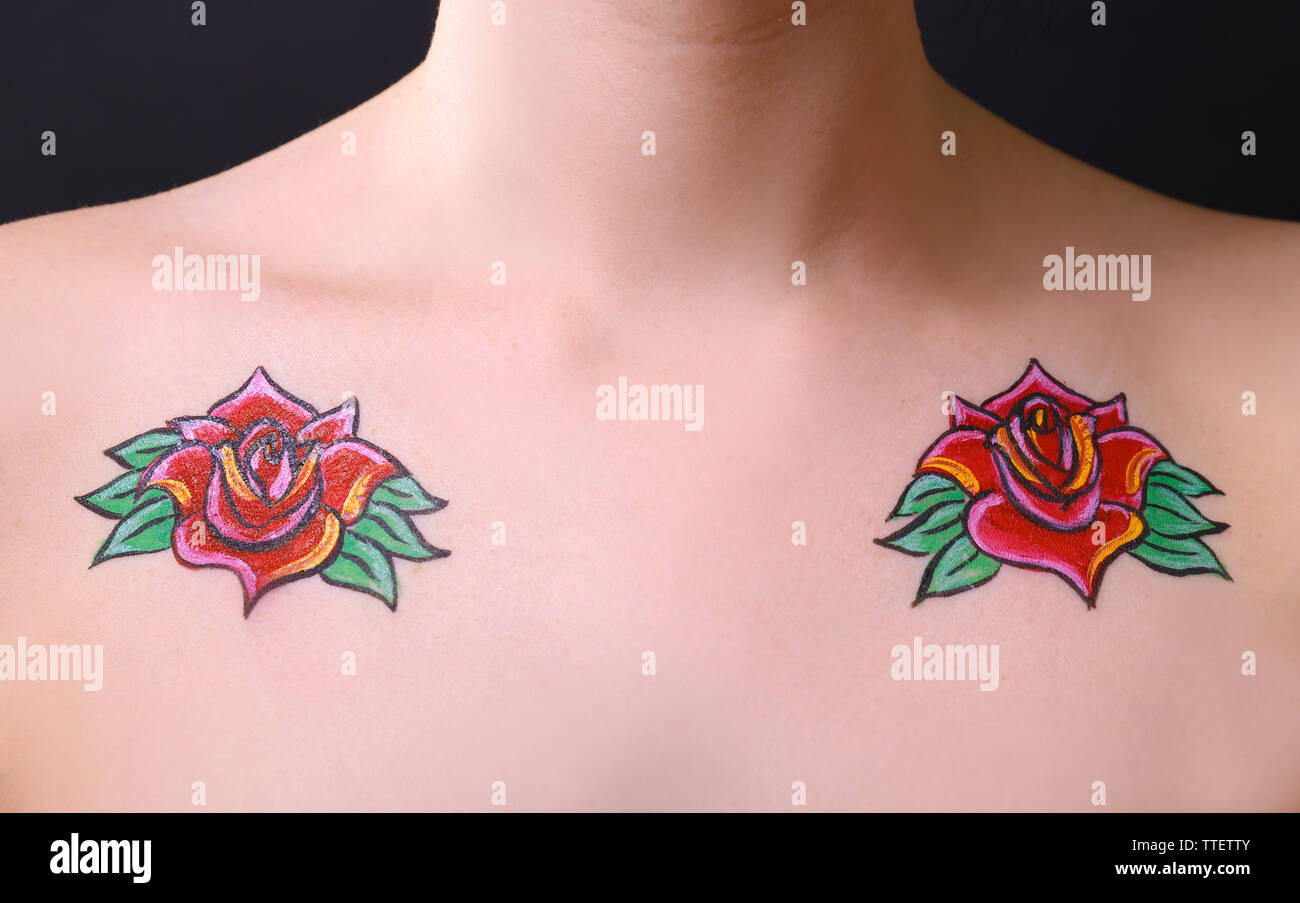 Flower body art on female shoulders over black background Stock Photo ...
