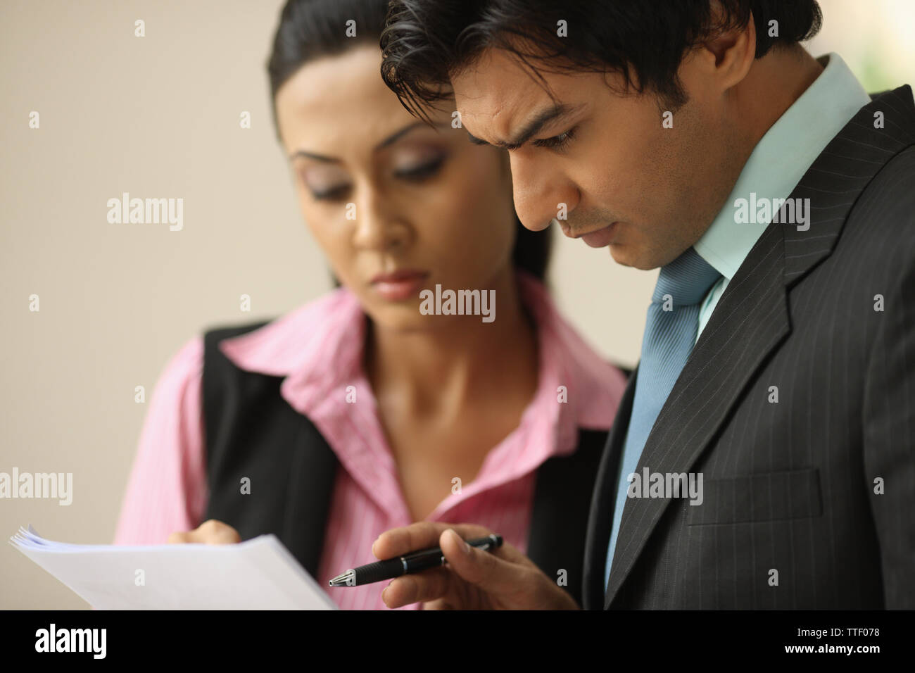 Indian two business executives going over documents Stock Photo