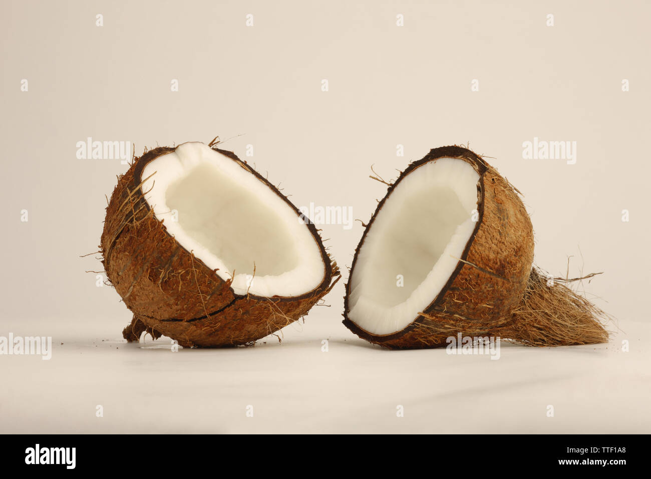 Close up of two halves of a coconut Stock Photo
