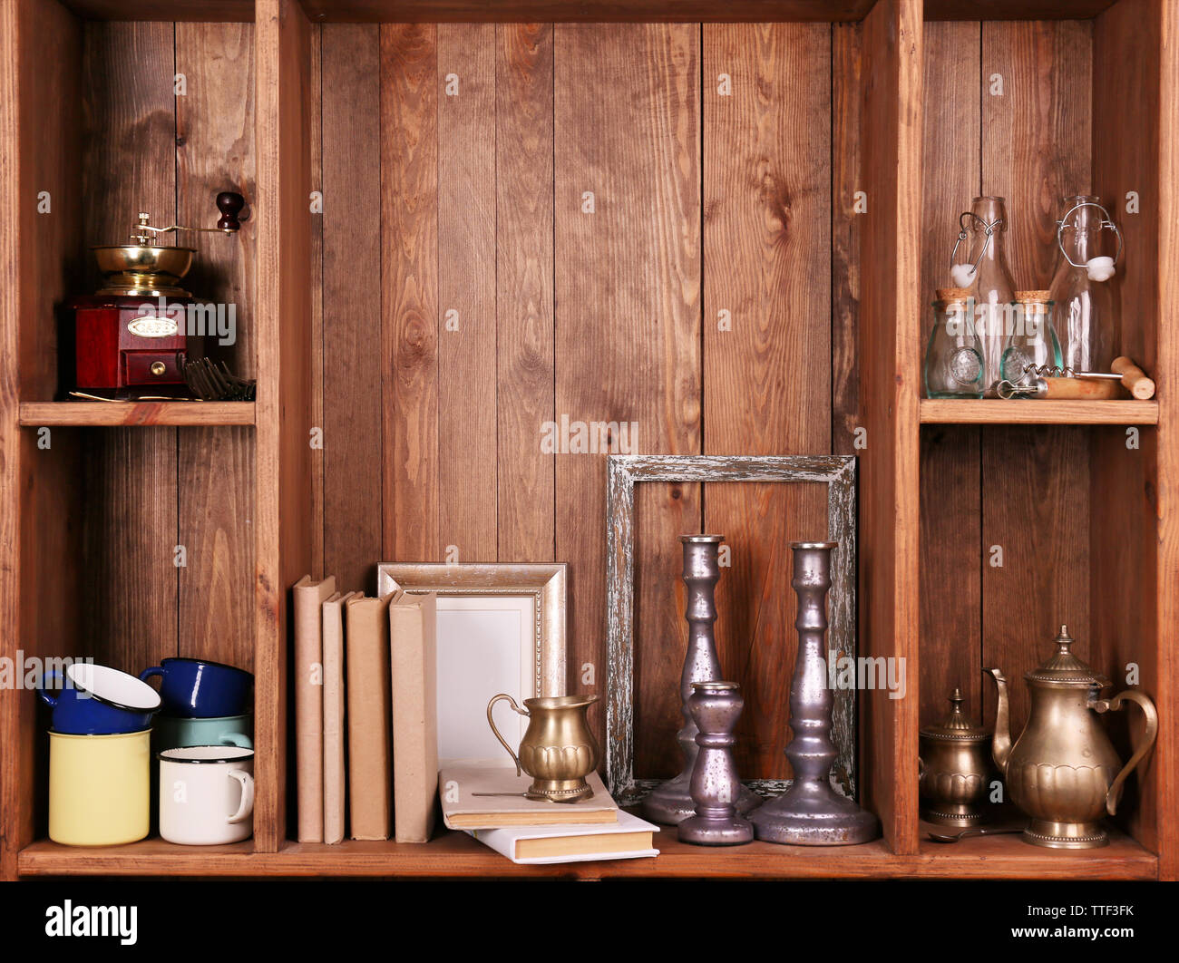 Wooden shelves with antiques things Stock Photo