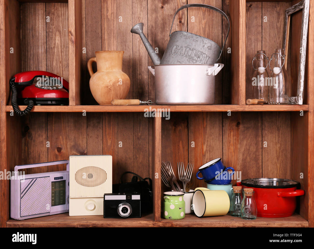 Wooden shelves with antiques things Stock Photo