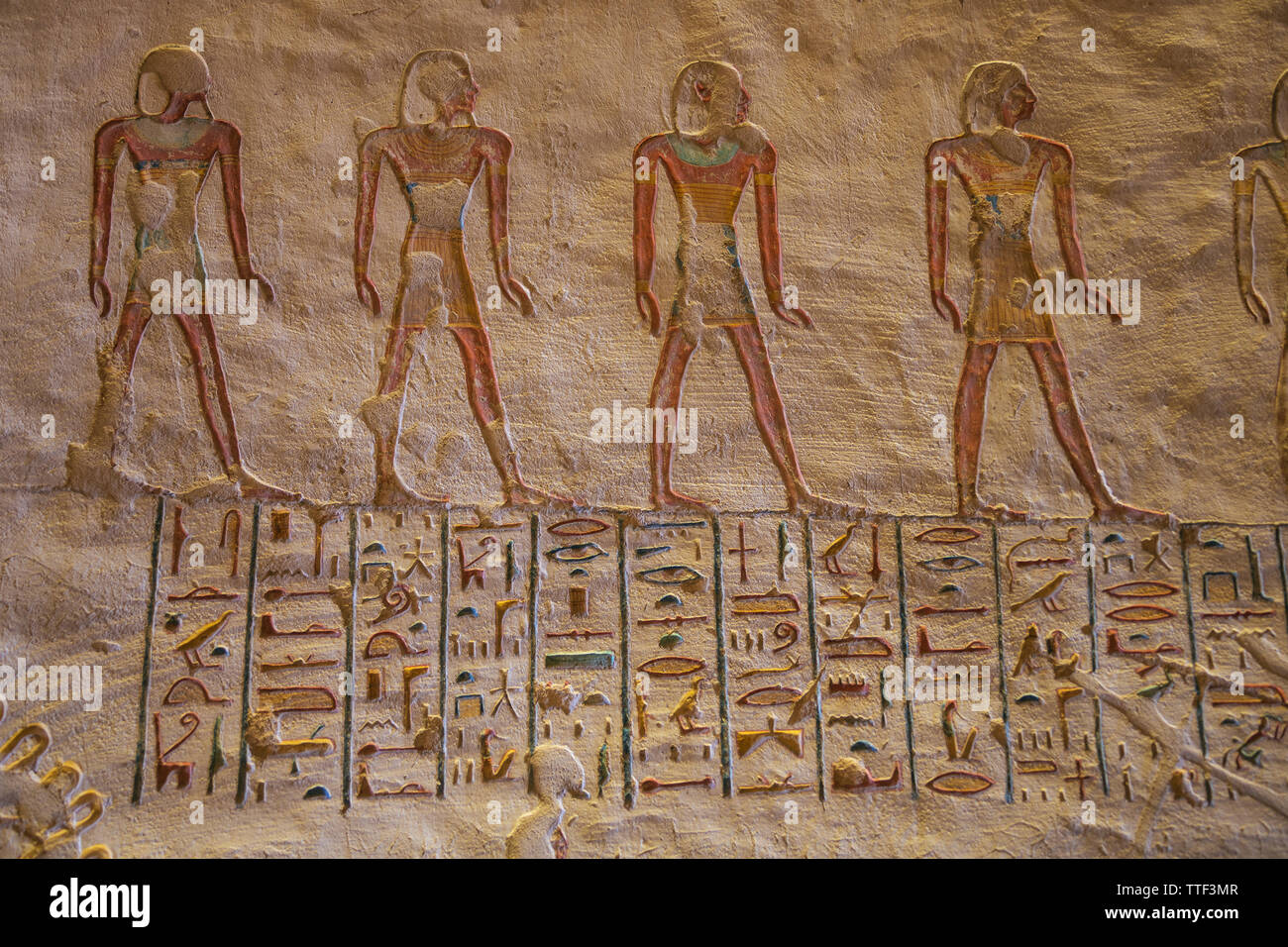 Colorful hieroglyphs in the tomb of Ramesses VII with painted figures in the Valley of the Kings Stock Photo