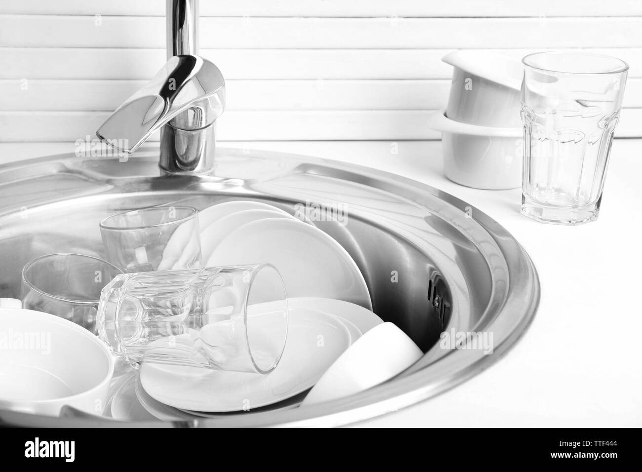 Pile of dishes in sink closeup Stock Photo Alamy