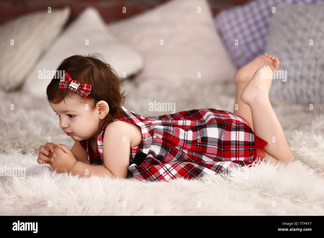 Little girl lying on the sofa, closeup Stock Photo - Alamy