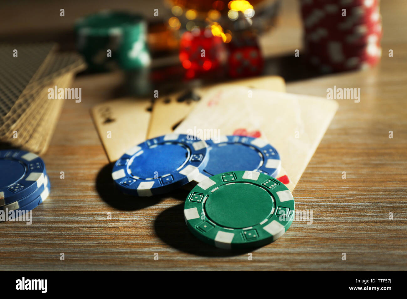 Set to playing poker with cards and chips on wooden background Stock