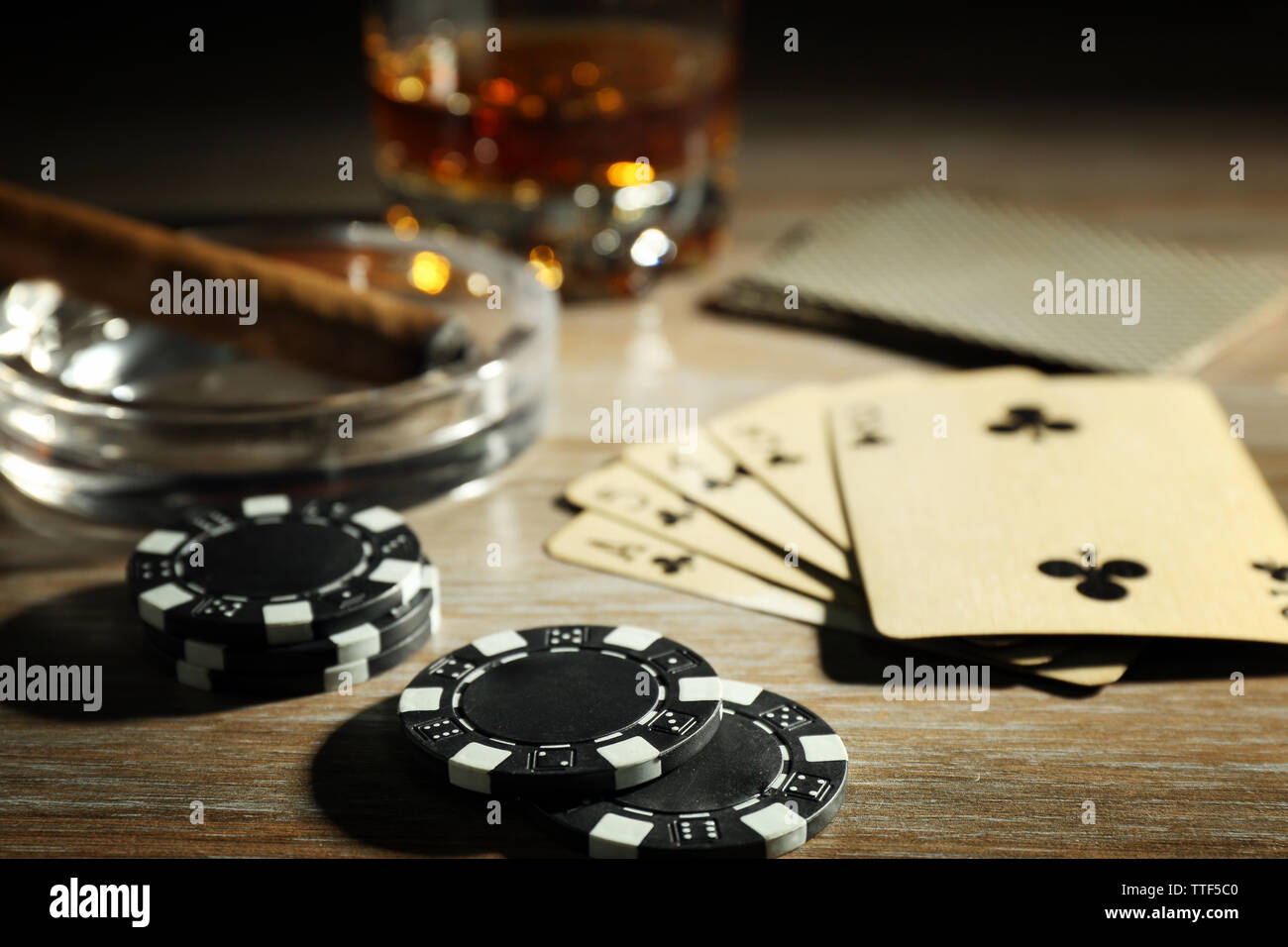 Set to playing poker with cards and chips on wooden background Stock