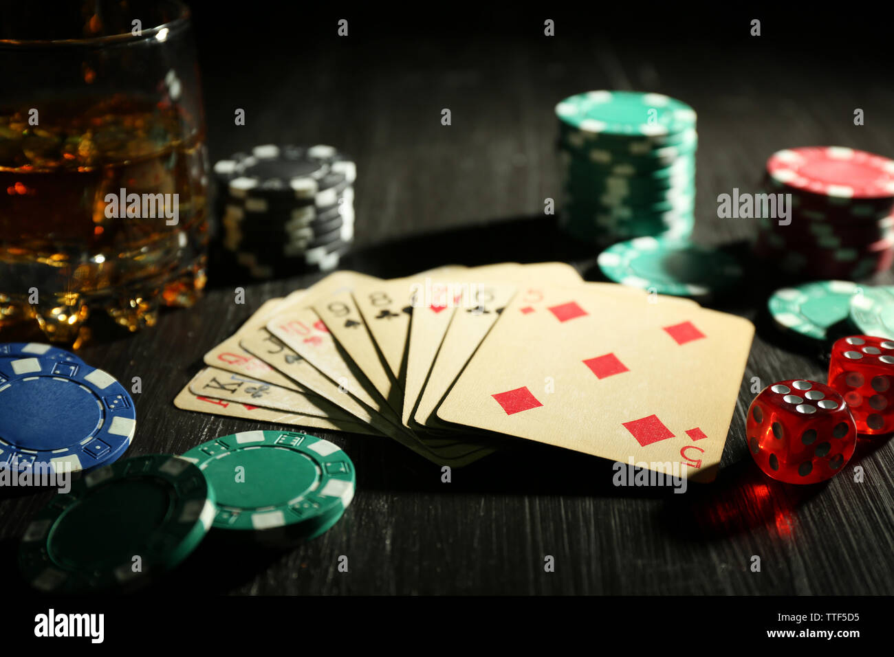 Set to playing poker with cards and chips on wooden background Stock