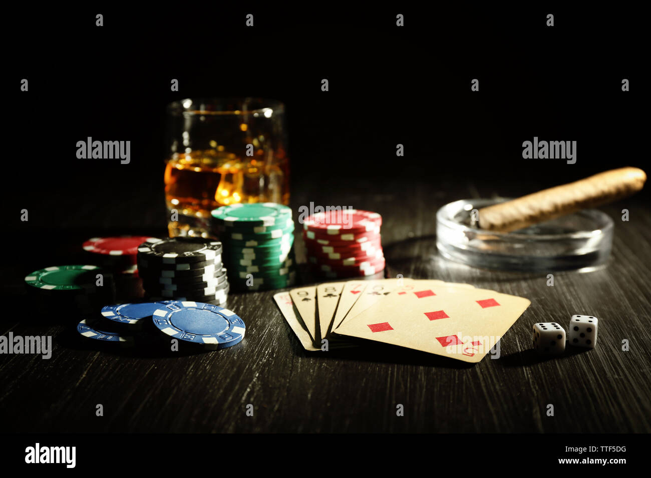 Set to playing poker with cards and chips on wooden background Stock