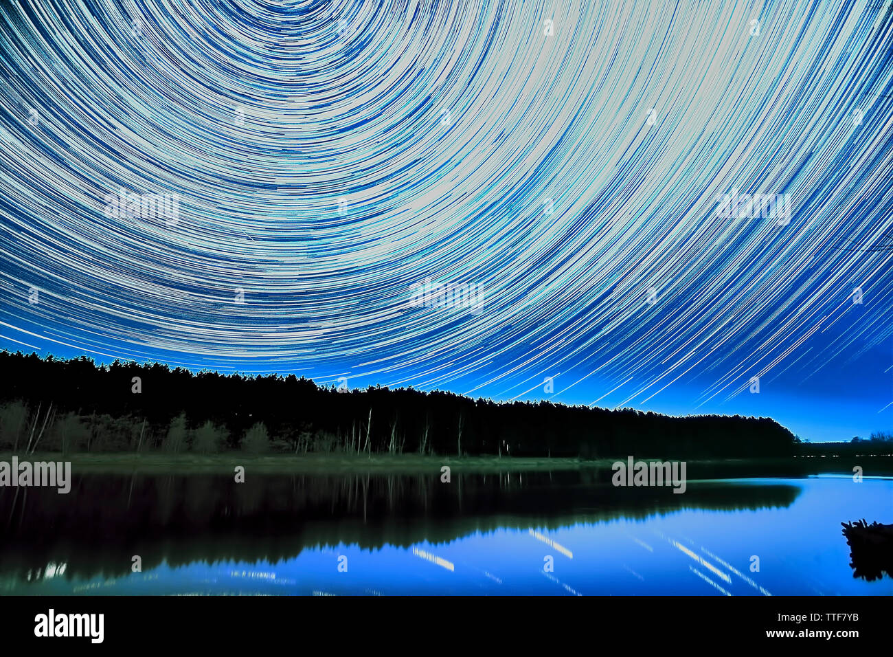Wonderful beautiful night sky star trail over the river and forest in ...