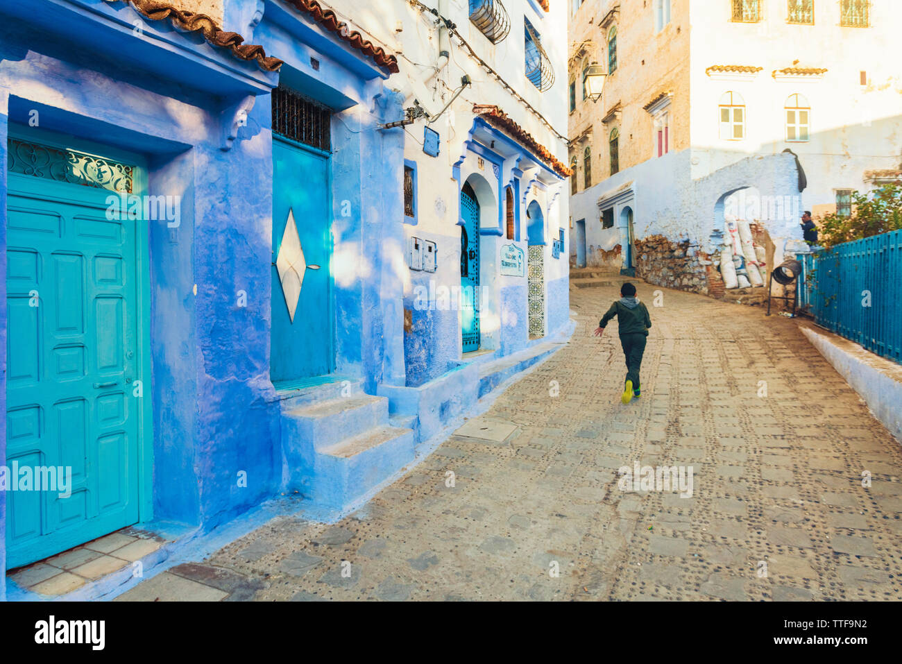 The old city of Chefchaouen with the famous blue buildings with a chil Stock Photo