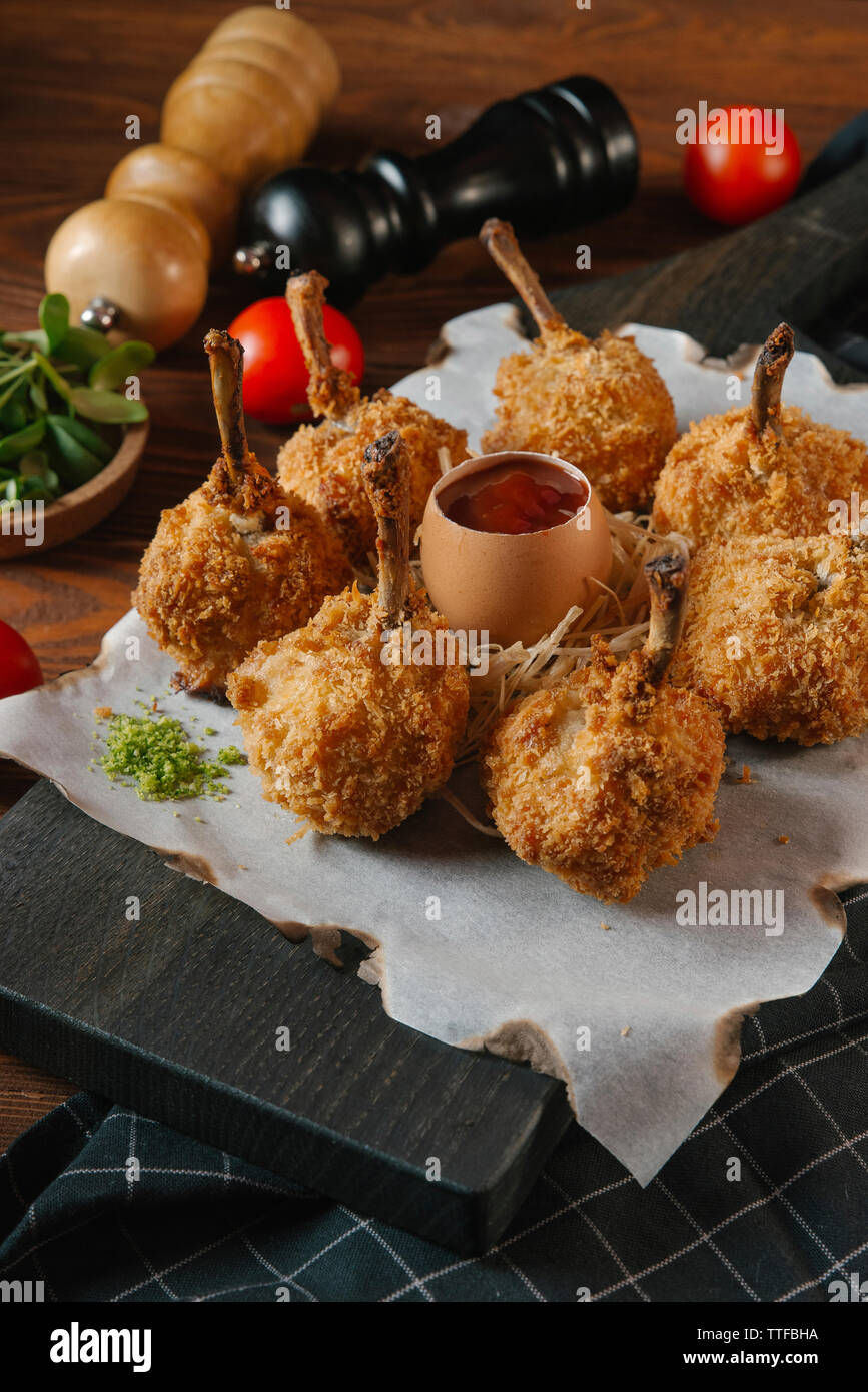 High angle view of fried quail legs with sauce in egg shell served on tray Stock Photo Alamy