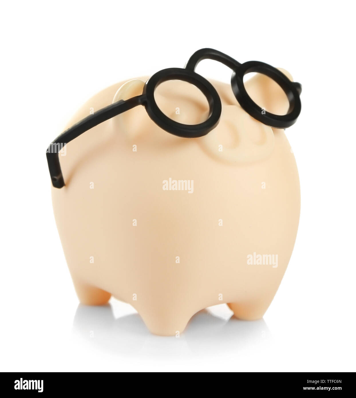 Piggy bank in glasses isolated on white Stock Photo - Alamy