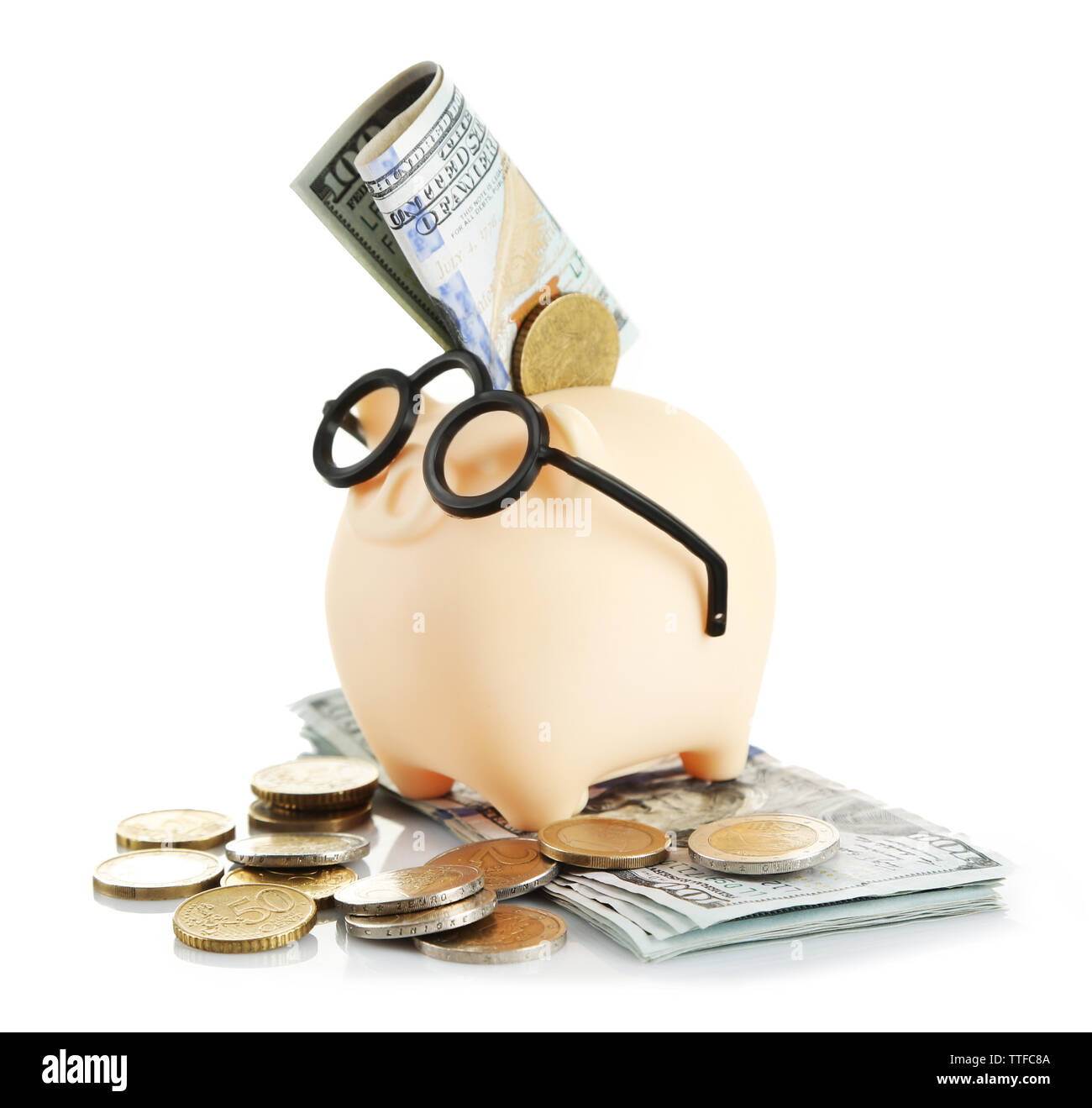 Piggy bank in glasses with dollars and coins isolated on white Stock ...