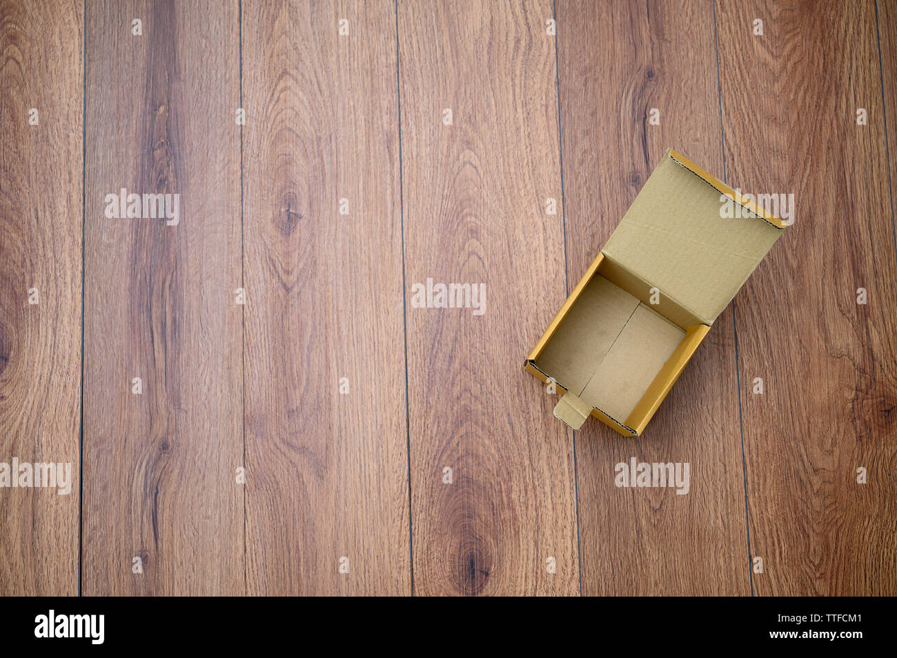 box empty open cardboard box on wooden surface with empty space top Flat lay Stock Photo