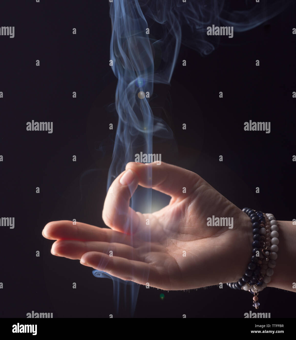 Hand woman enlightened while meditating Stock Photo