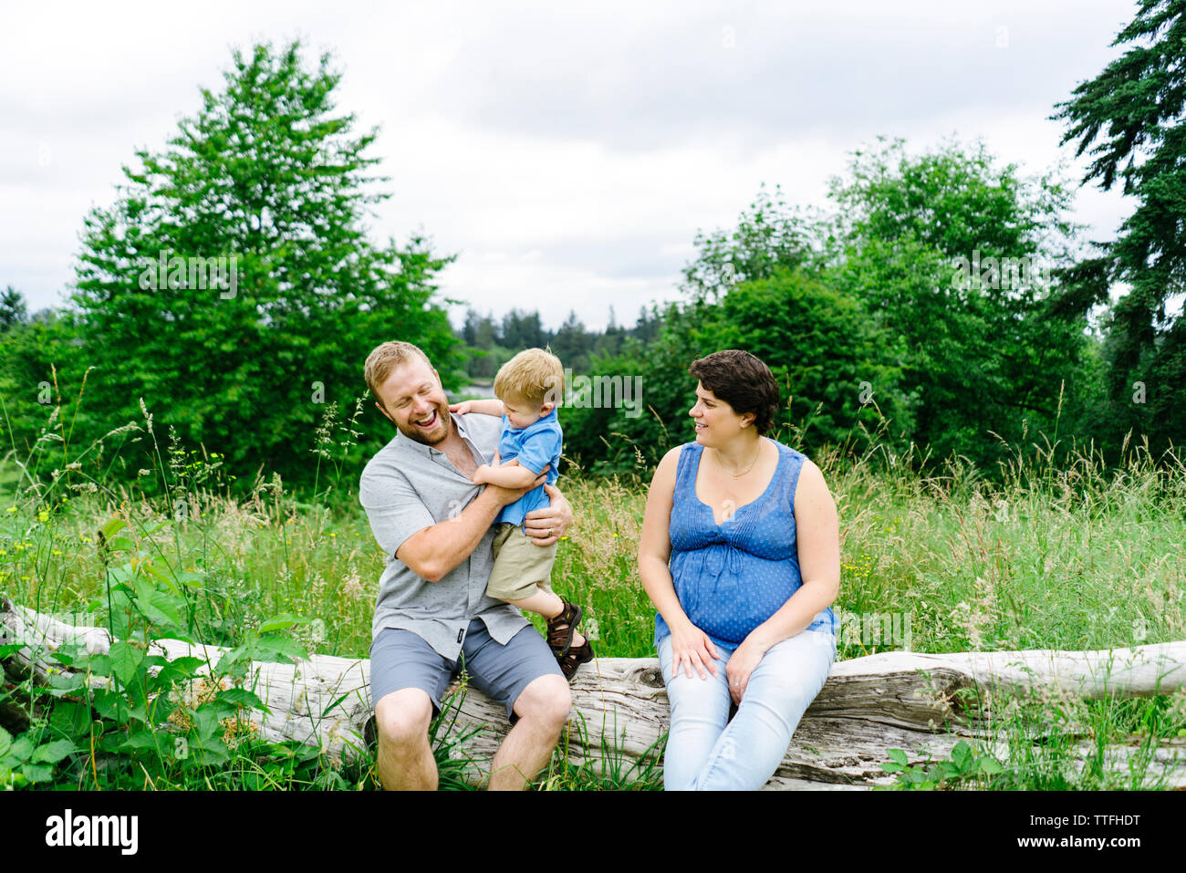 Straight on portrait of a young family playing together Stock Photo