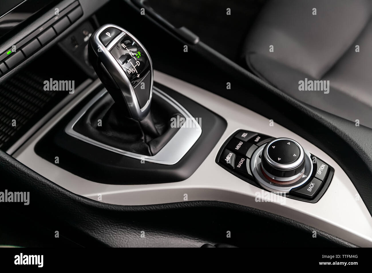 Closeup of the accelerator handle and side mirror buttons. automatic