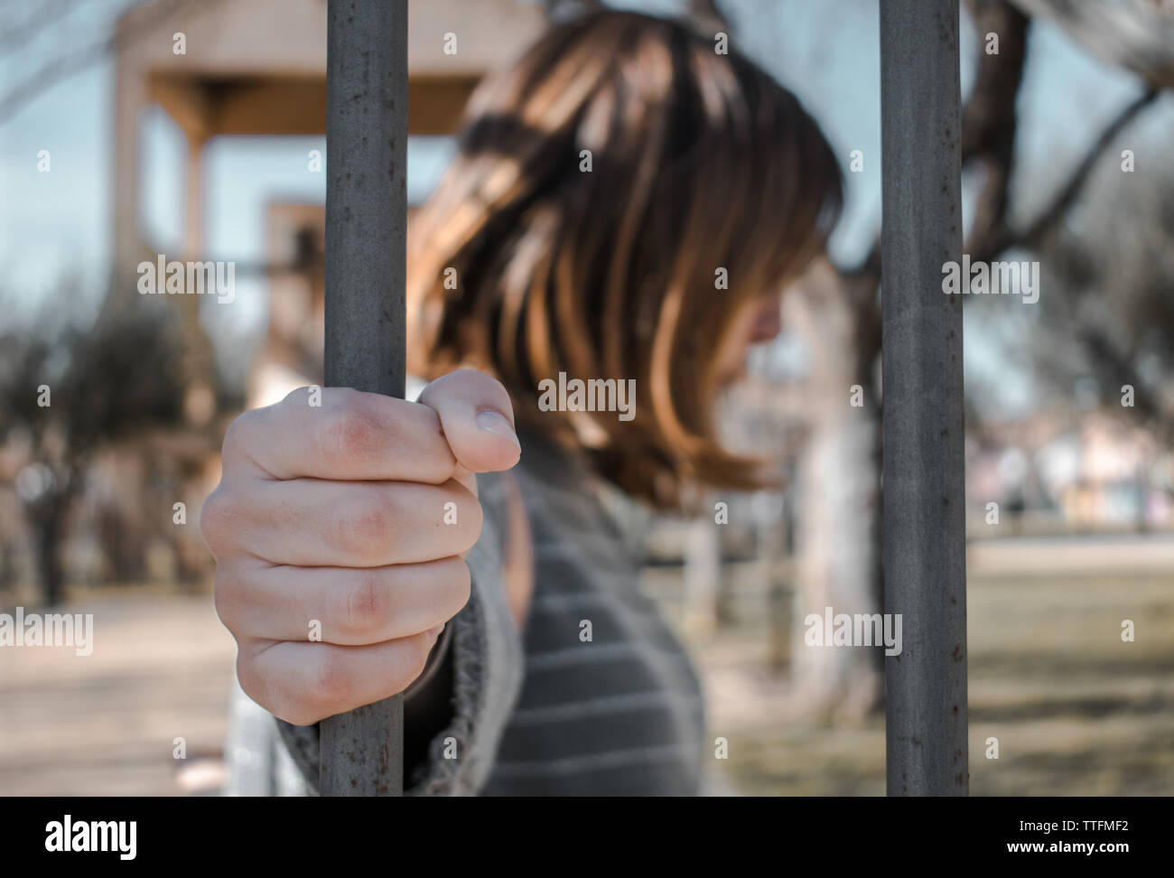Woman's hands and bars. Stock Photo