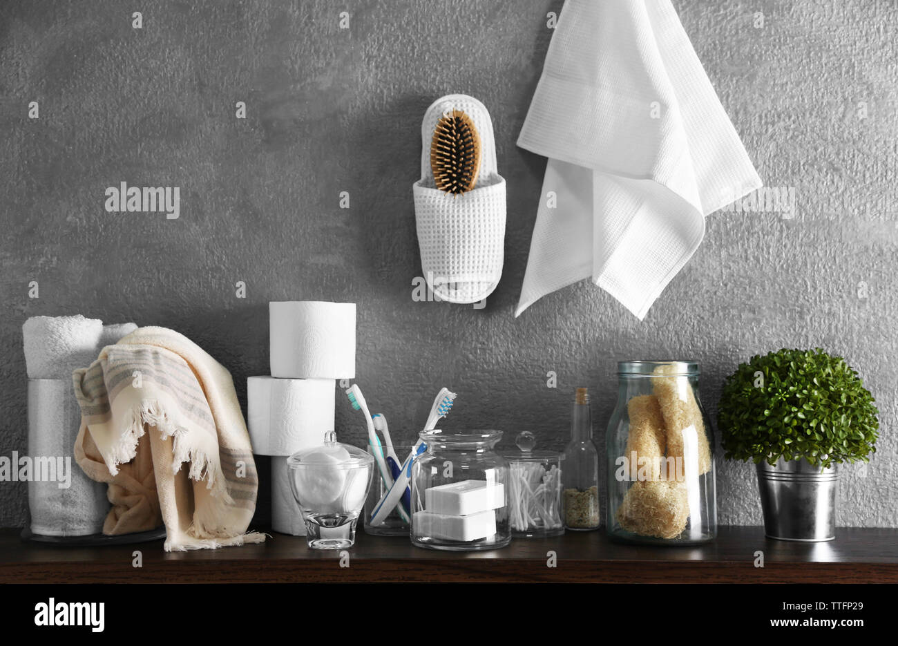 Bath accessories on grey wall background Stock Photo - Alamy