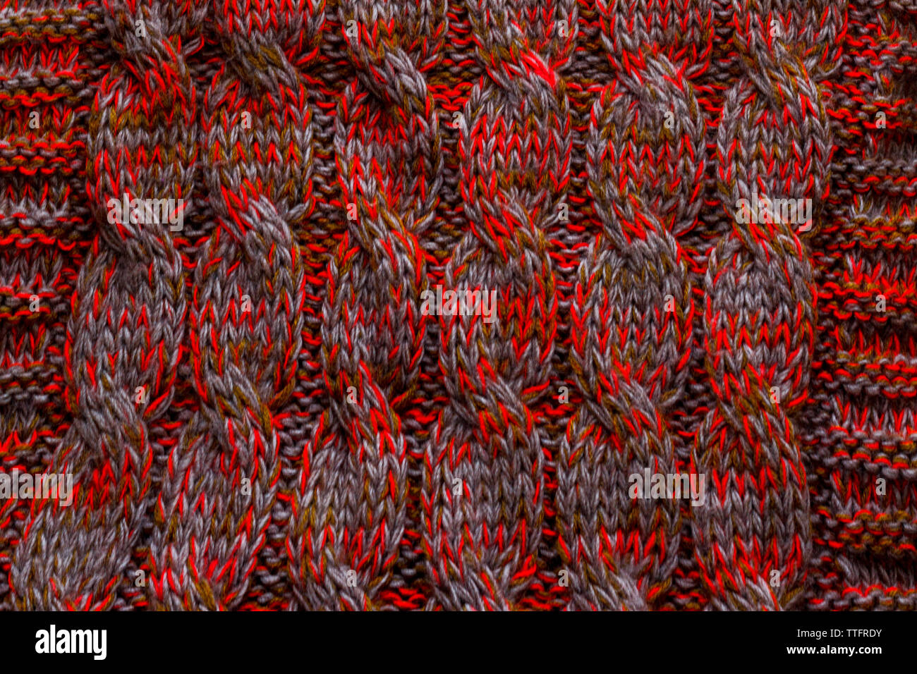 Knitted texture of red gray dark green color Stock Photo