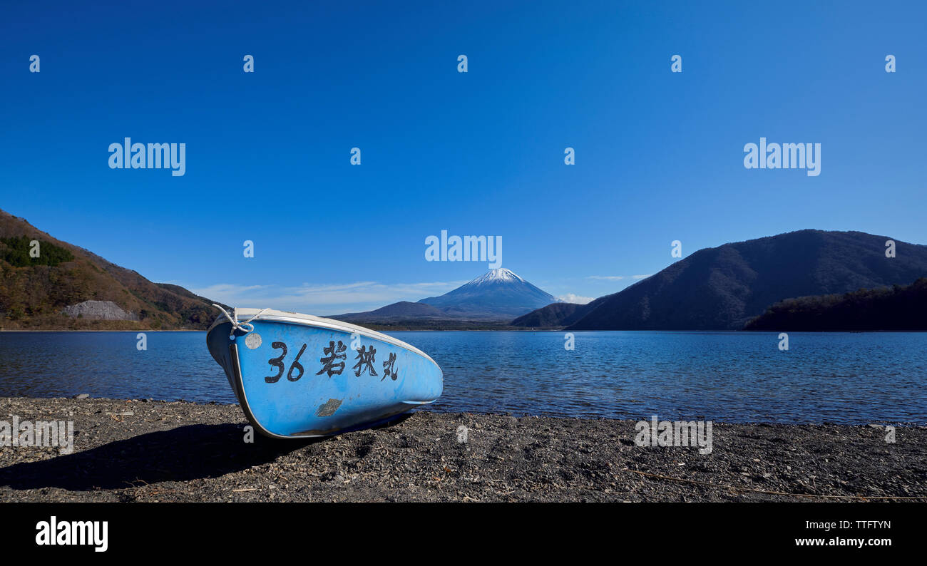 Rental boat and Mount Fuji from lake Motosu, Yamanashi Prefecture Stock Photo