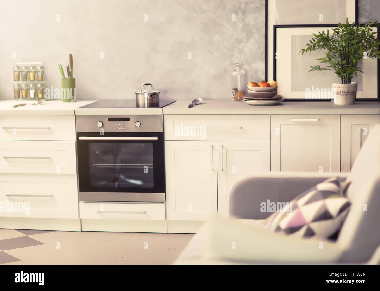 Modern kitchen interior with white furniture and electric stove Stock ...
