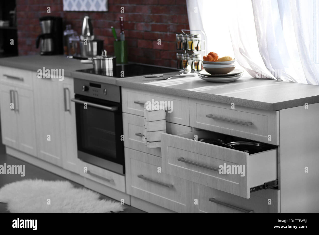 Modern kitchen interior with white furniture and electric stove Stock ...
