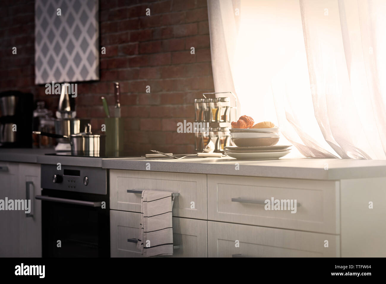Modern kitchen interior with white furniture and electric stove Stock ...