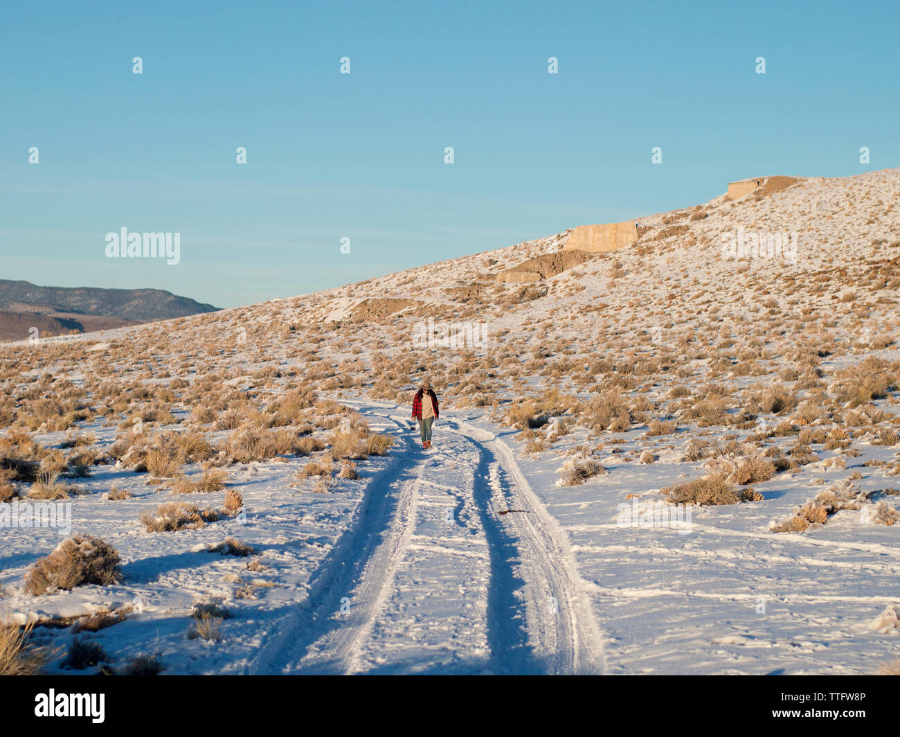 Woman walks through road hi-res stock photography and images - Alamy