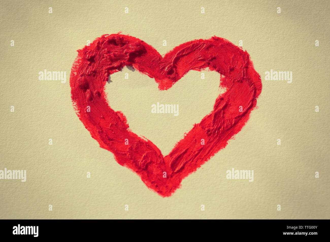 Red heart painted on light background Stock Photo