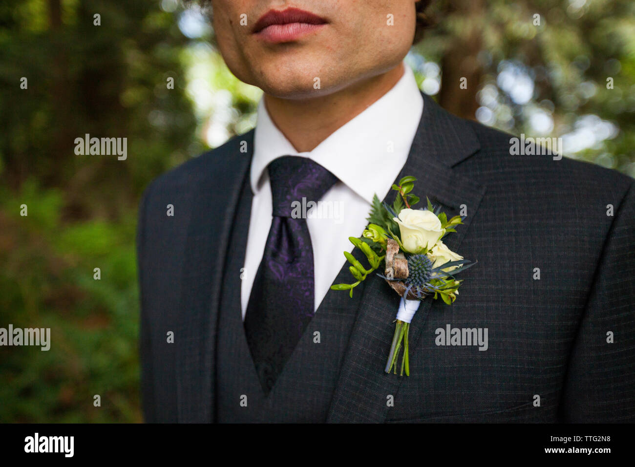Midsection of bridegroom in full suit Stock Photo