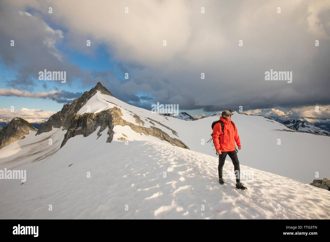 Mountaineer descends from summit of Cypress Peak, B.C. Stock Photo