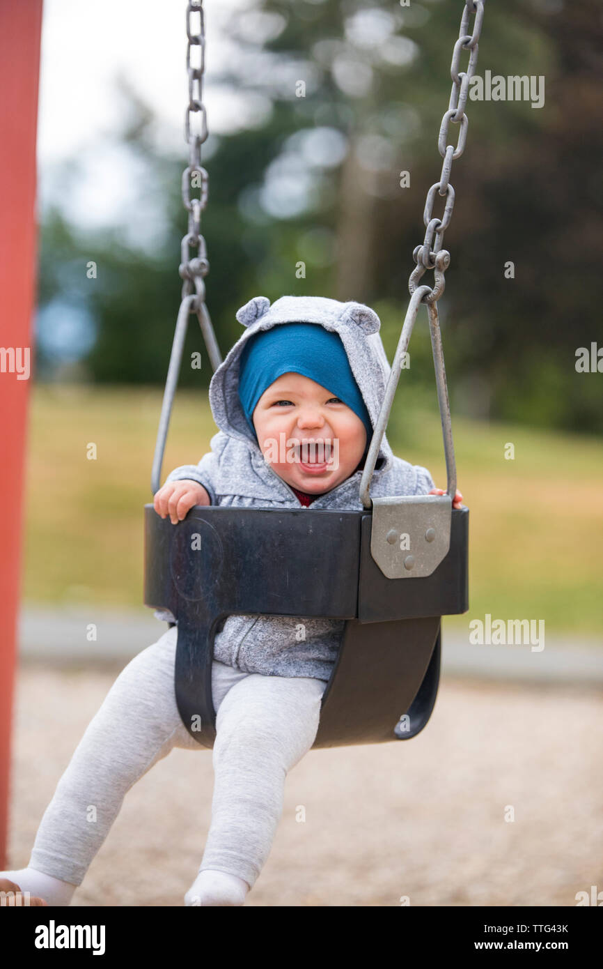 Children swing set park hires stock photography and images Alamy