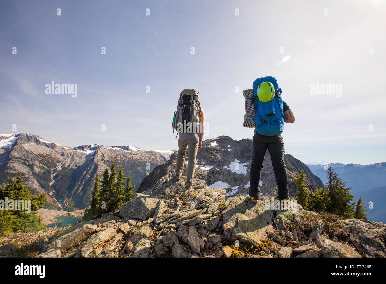 Two mountaineers look at their objective, Douglas Peak, B.C., Canada. Stock Photo