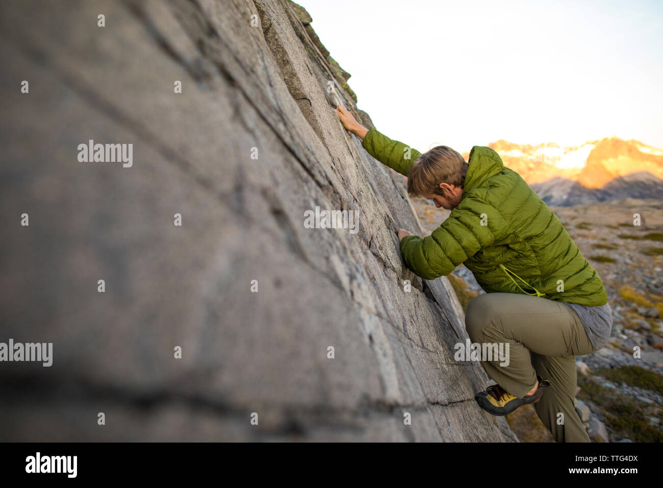 Man rock climbing in the Coast Mountains, B.C. Stock Photo