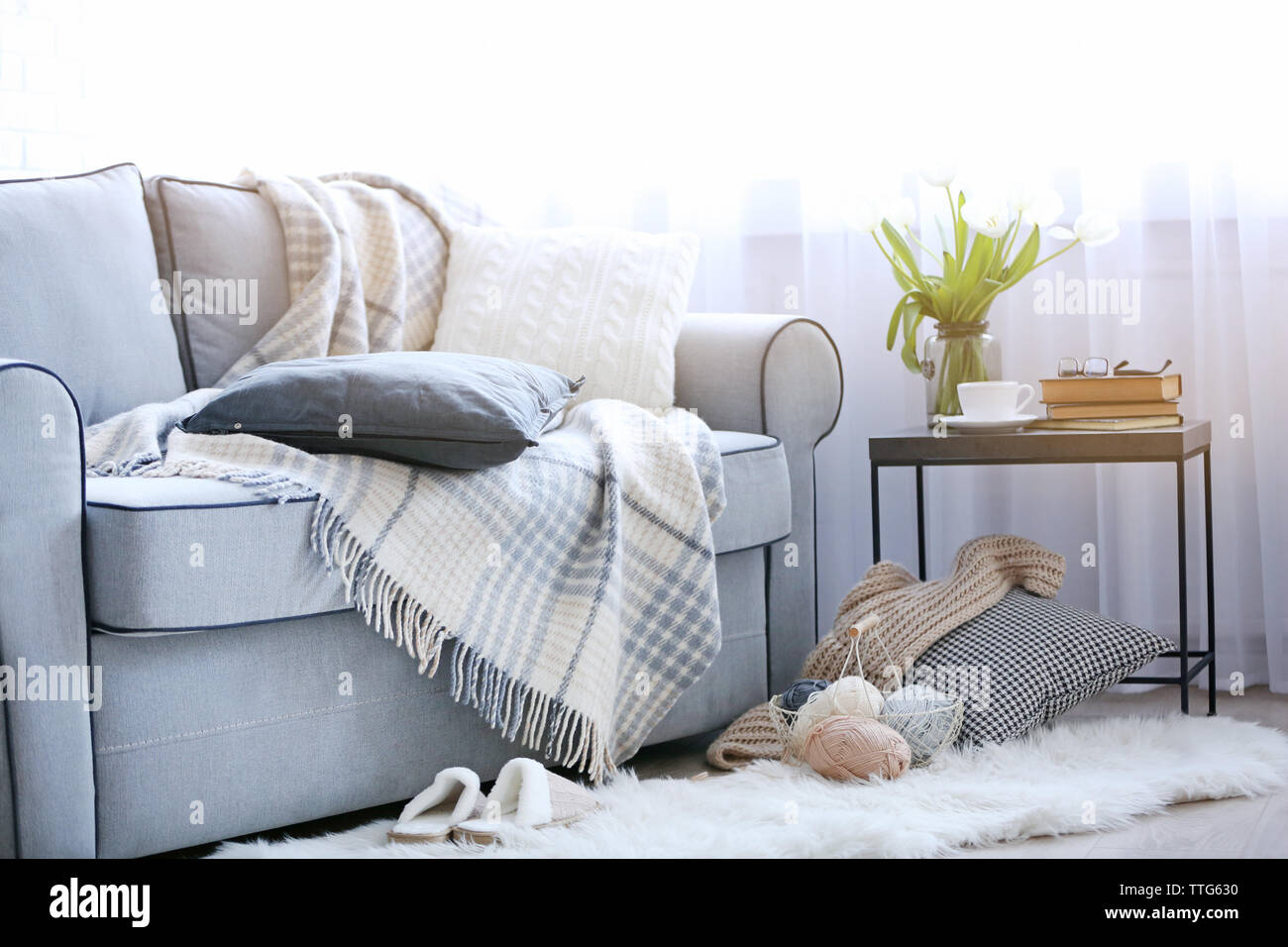 Interior of living room with sofa and small table Stock Photo - Alamy