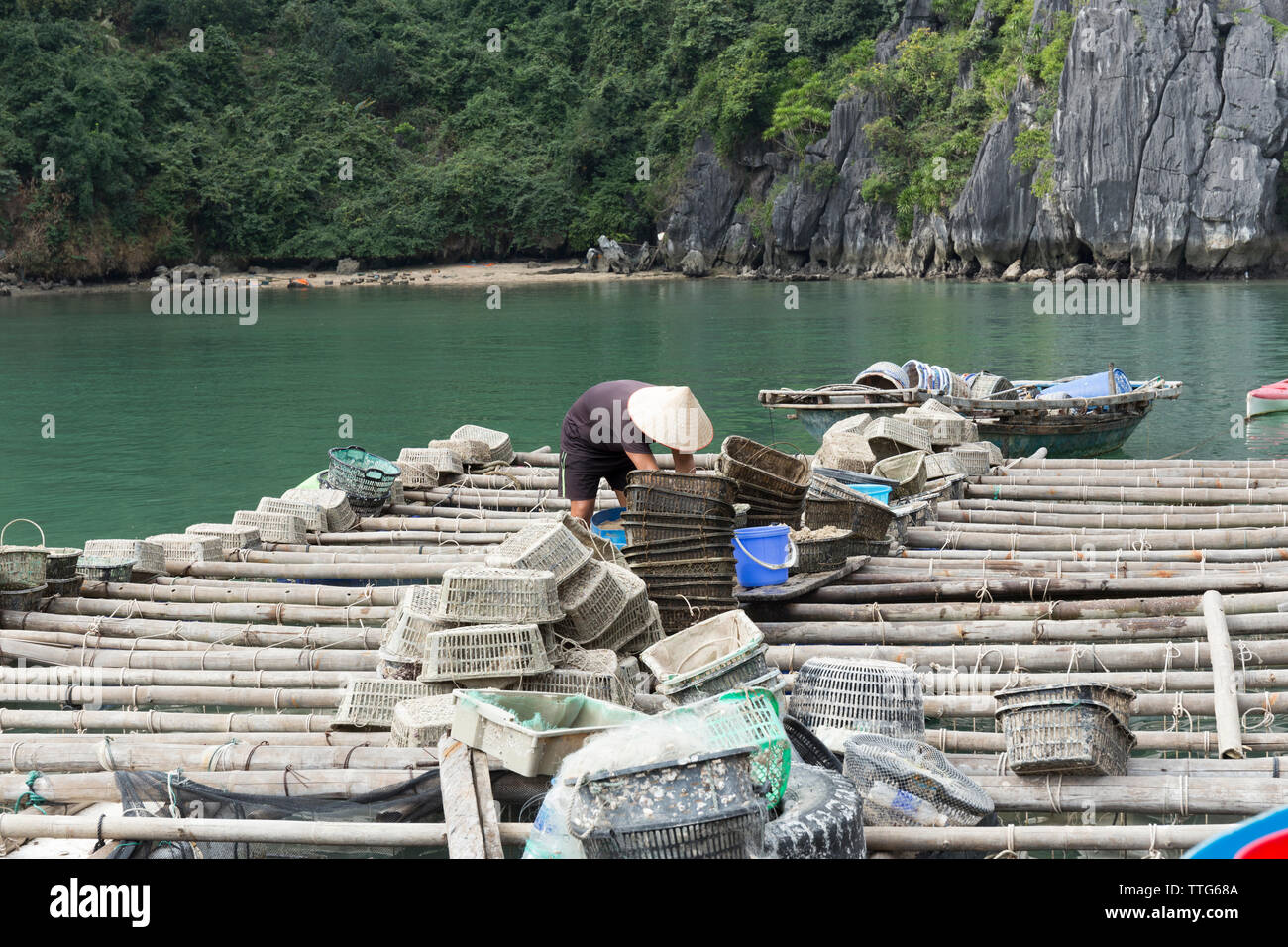 fisherman on floating fishing village Stock Photo