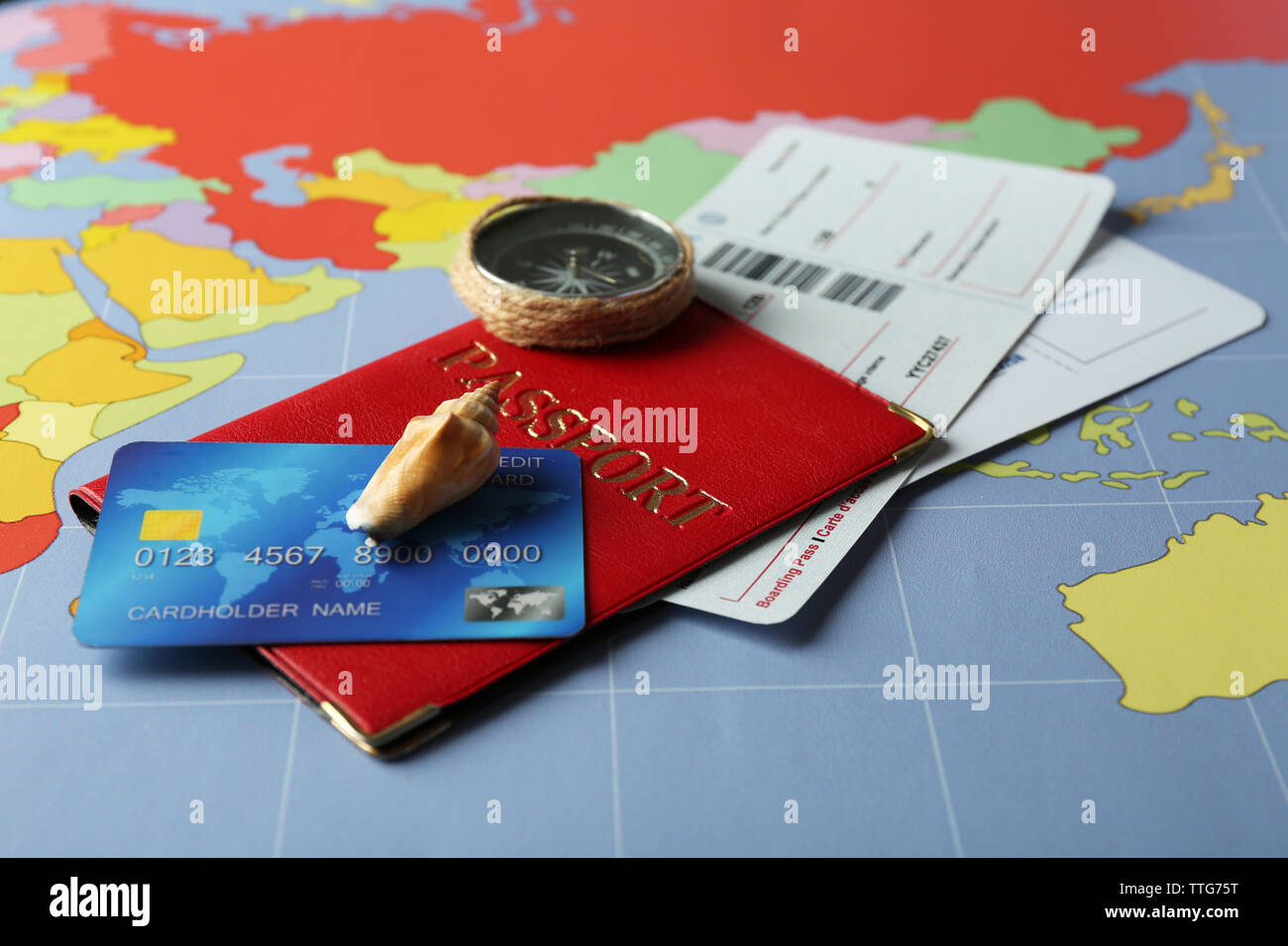 Credit cards with passports and tickets for vacations on the world map background Stock Photo