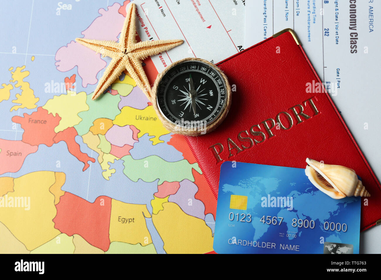 Credit cards with passports and tickets for vacations on the world map background Stock Photo