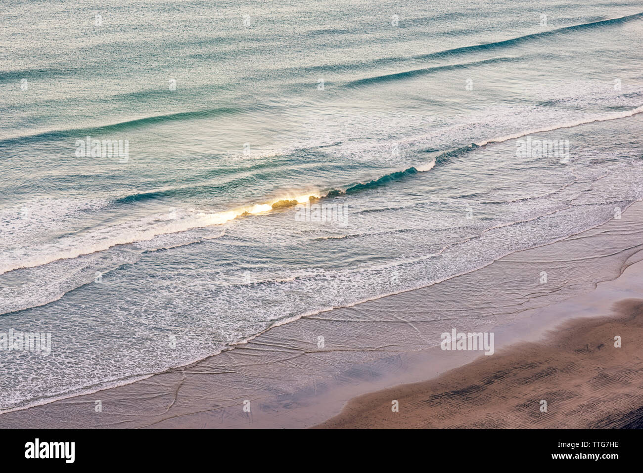 Waves breaking on an empty beach. La Jolla, CA. Stock Photo