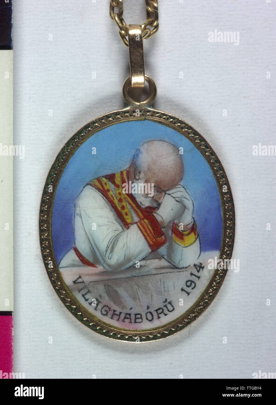 Emperor Franz Joseph I- patriotic pendants, gold, enamel, at golden necklace picture of the praying emperor with Hungarian inscription 'VILÀGHABORU 1914' (= world war 1914) on the reverse side Hungarian inscription: 'ISTENNEL / KIRÀLYERT / ÈS / HAZAÈRT' (with God / for the King / and / home country), Additional-Rights-Clearance-Info-Not-Available Stock Photo