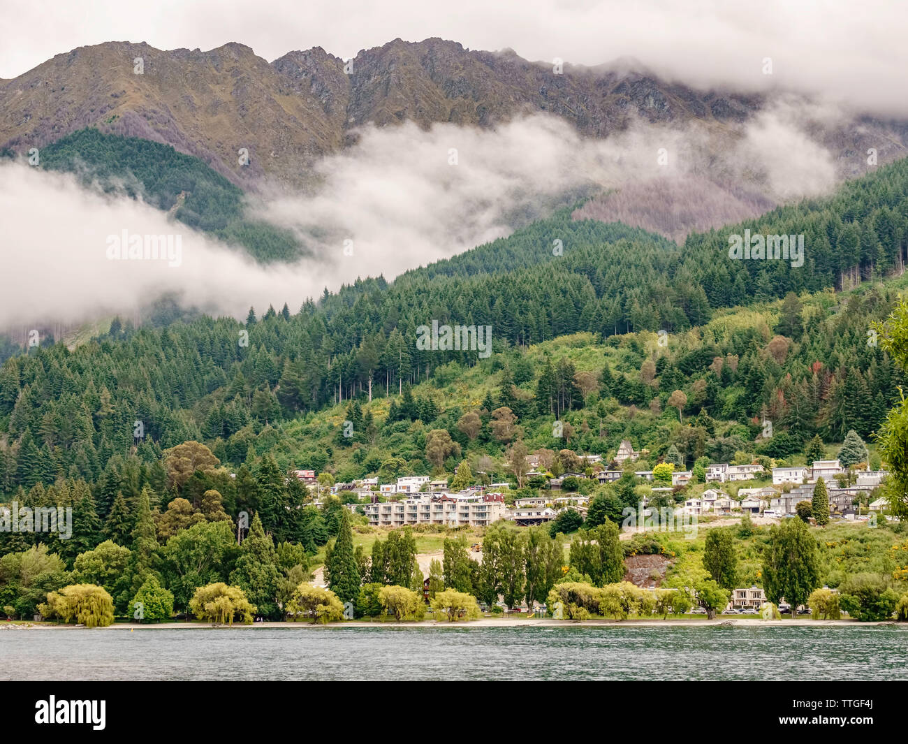 Lakeside residential area of Queenstown, New Zealand, on a drizzly day Stock Photo